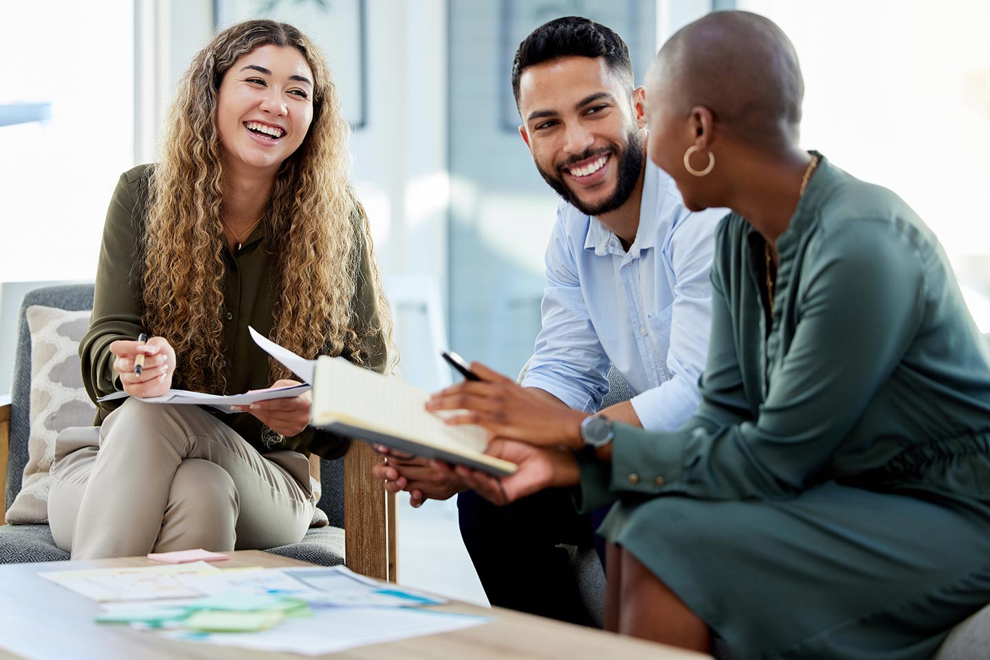 A leasing team collaborating on a laptop