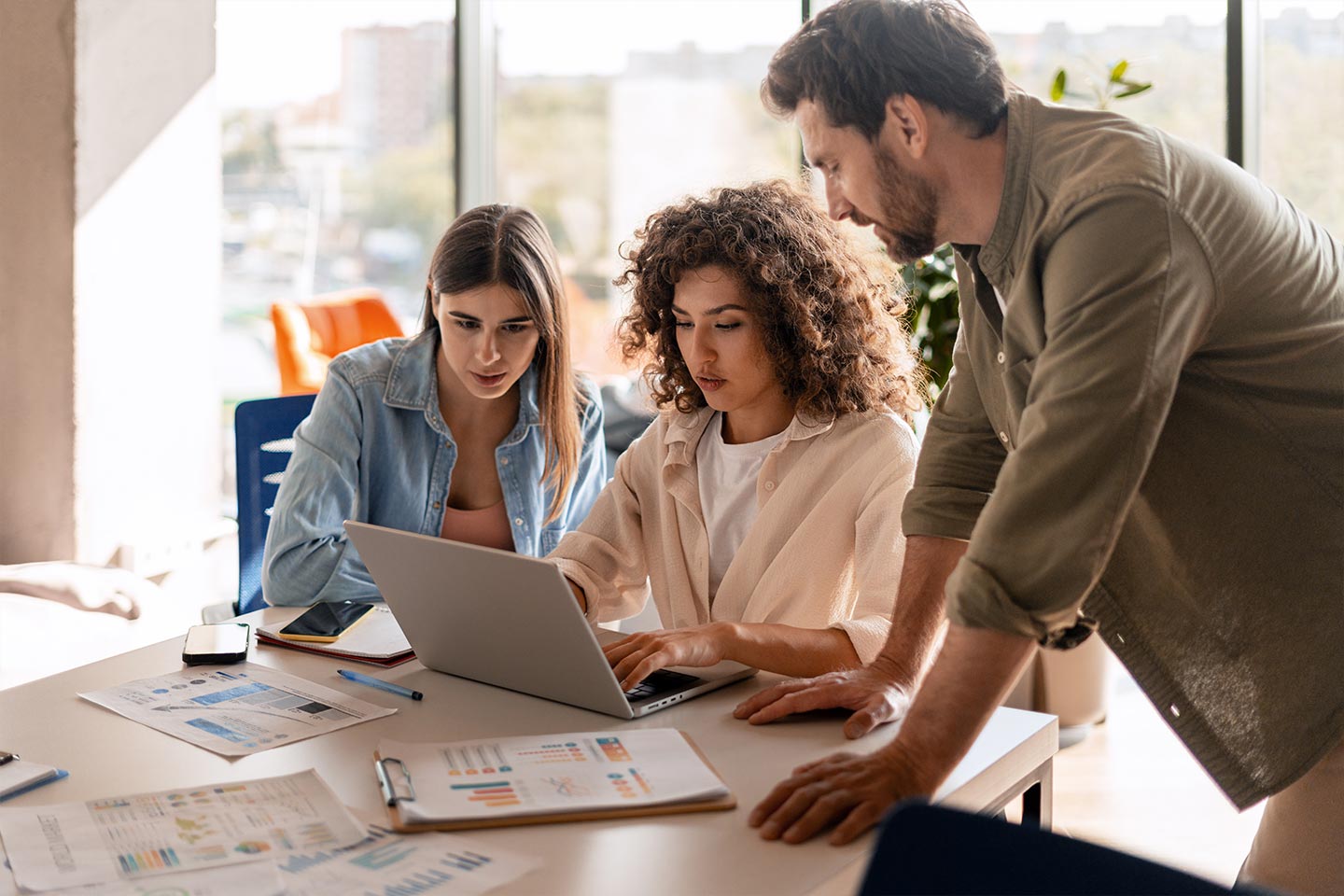 A multifamily marketing team planning social content together