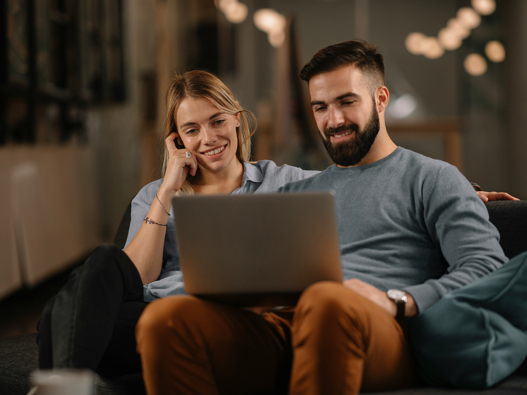 A leasing team collaborating on a laptop