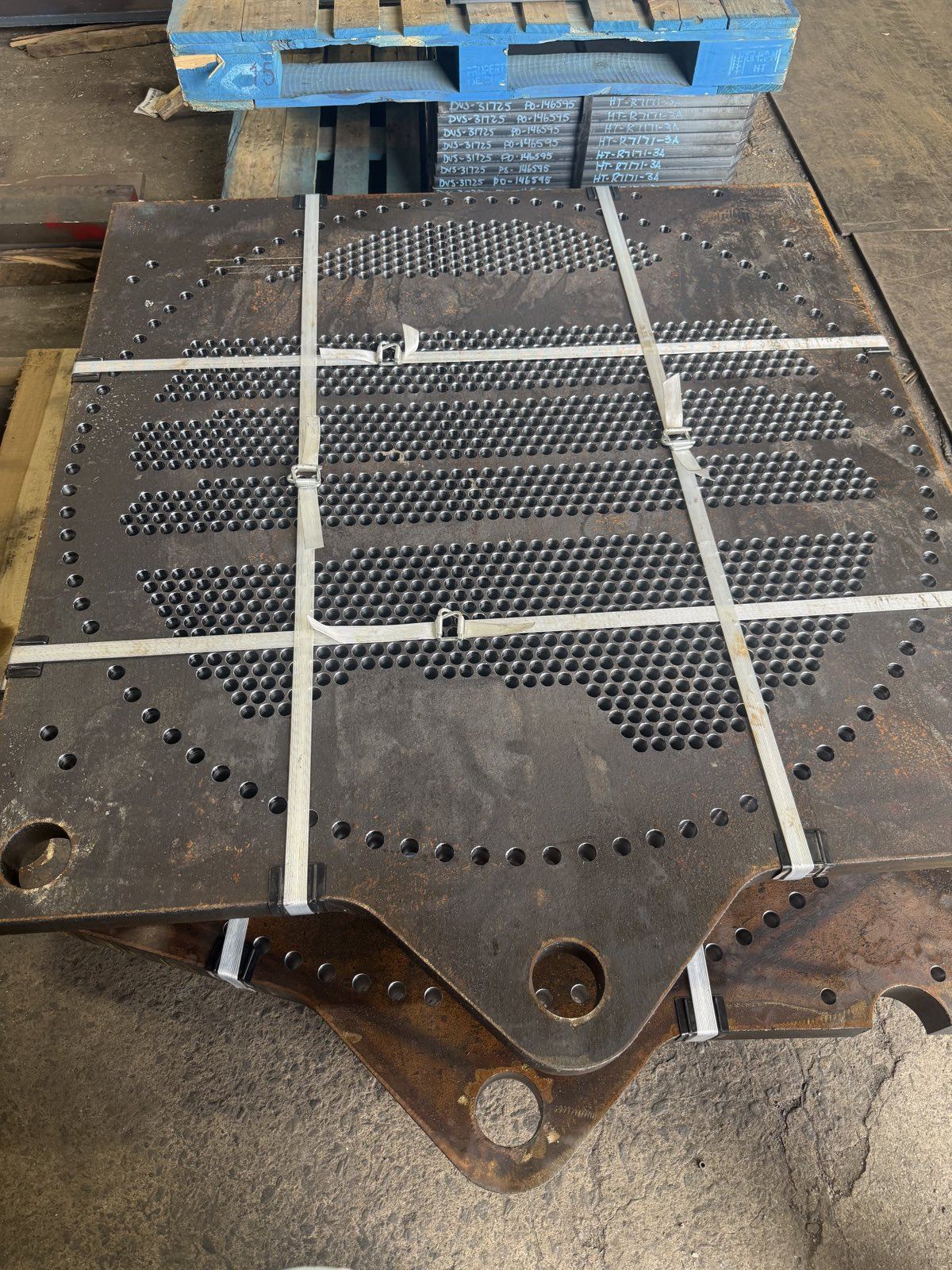 Stack of drilled tubesheets strapped and ready to ship