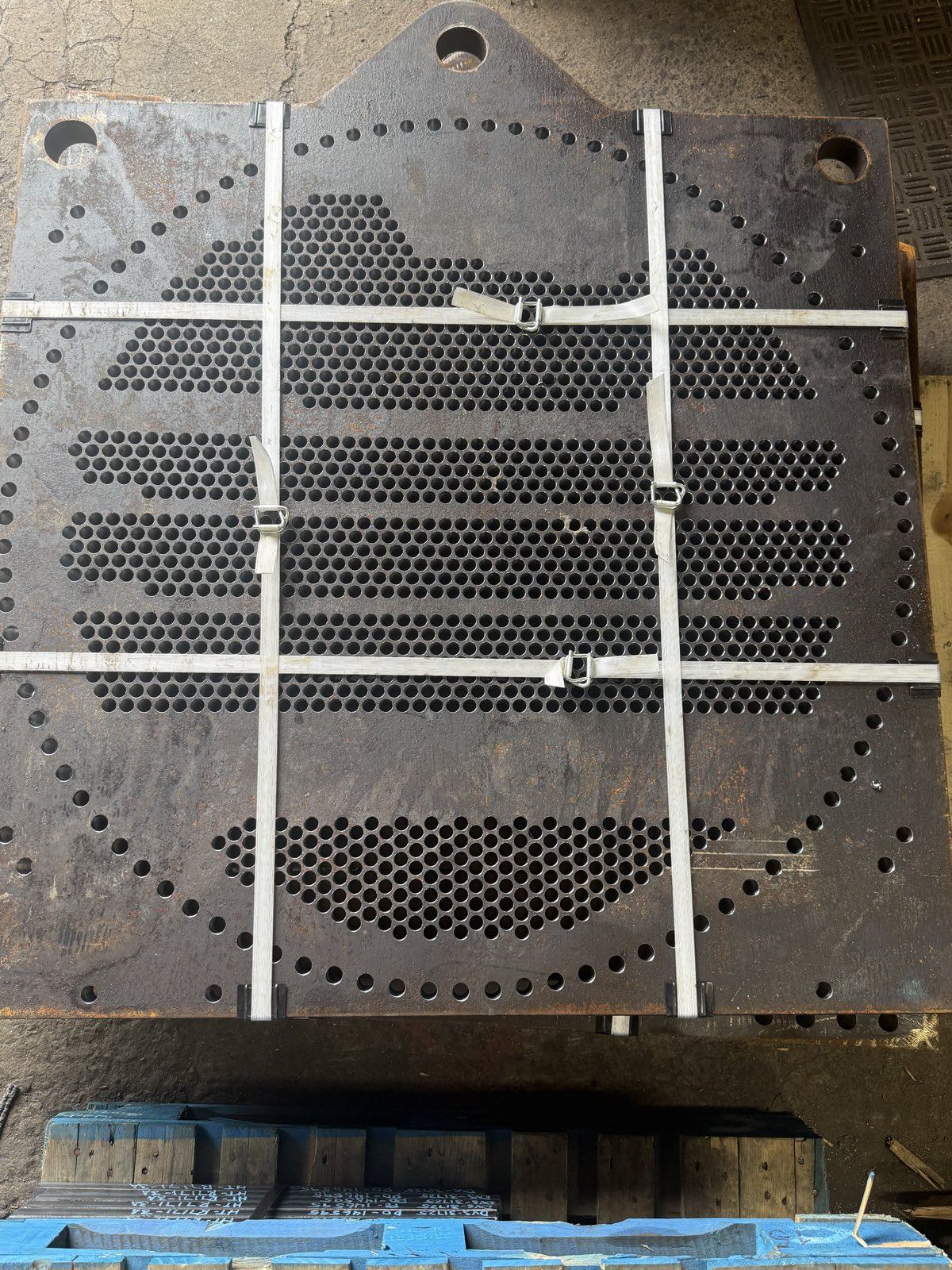Drilled heat exchanger tubesheet banded for shipment