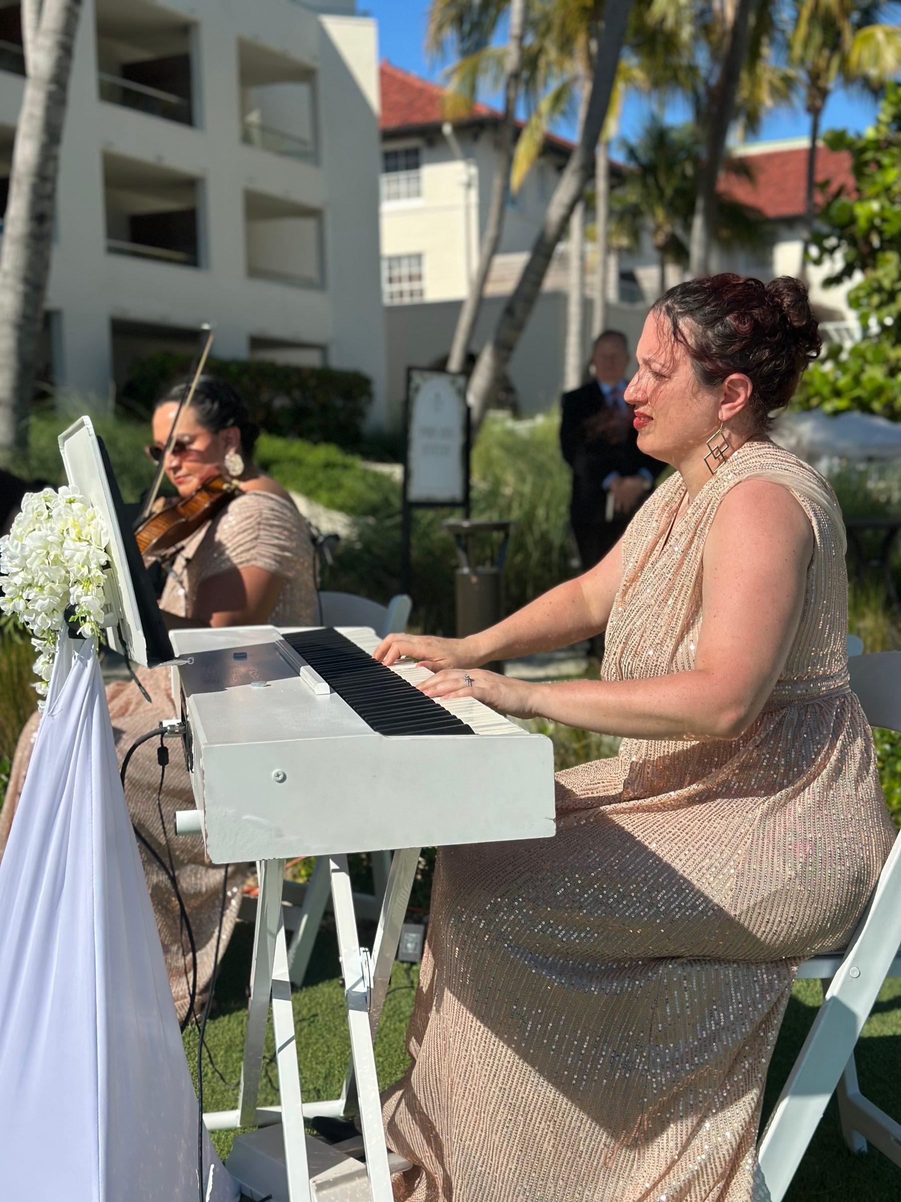 Violinist West Palm Beach performing with just the back of the head visible and the violin