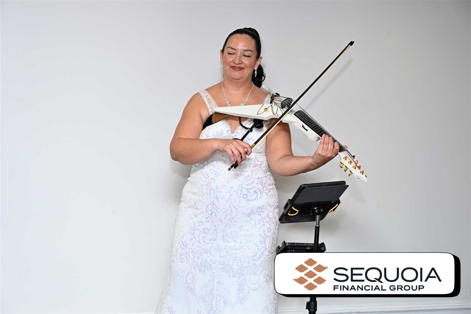 Violinist in Vero Beach performing in white dress for Sequoia Financial Customer Appreciation