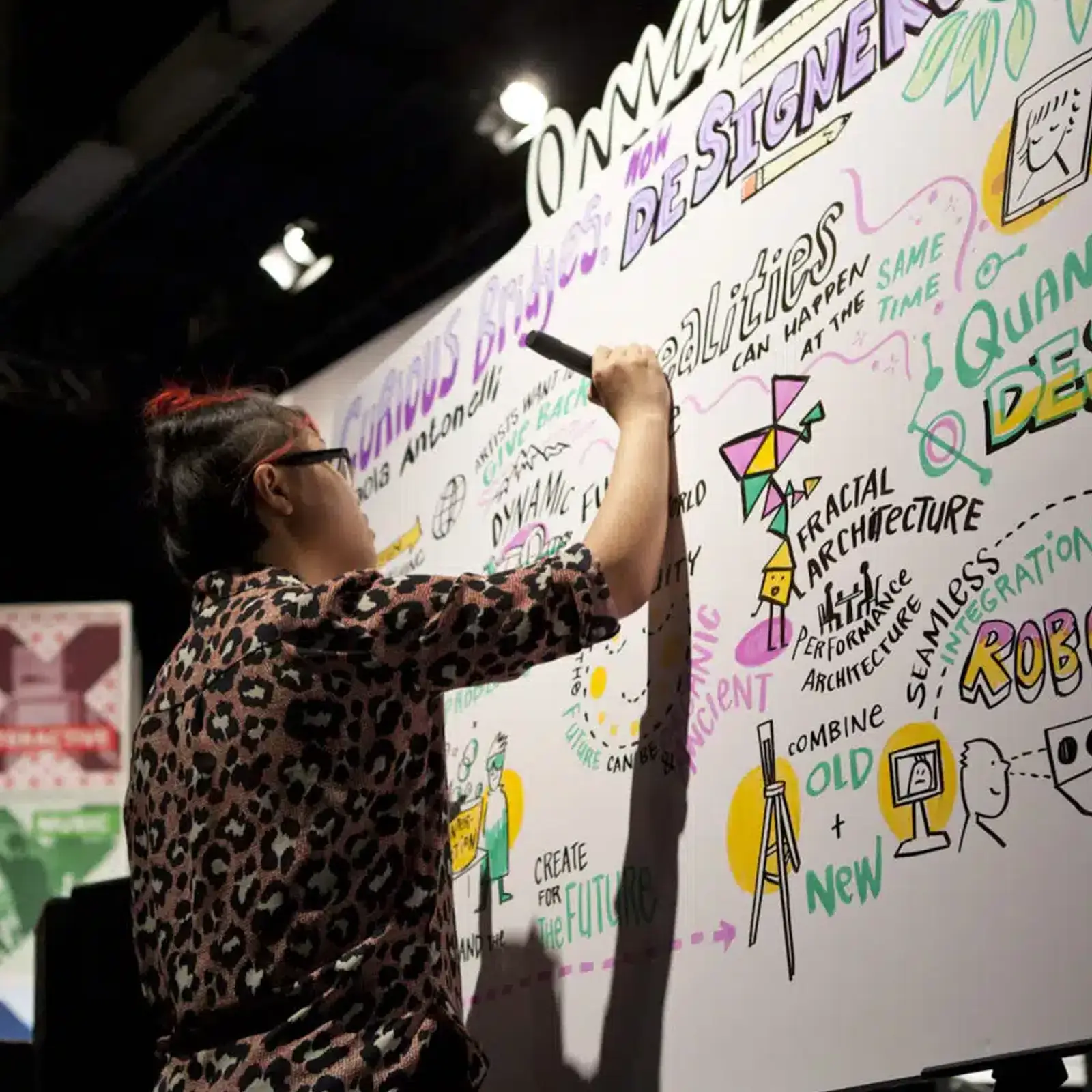 ImageThink employee creating a whiteboard display